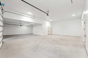 Garage featuring baseboards