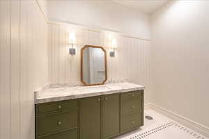 Bathroom with vanity and baseboards