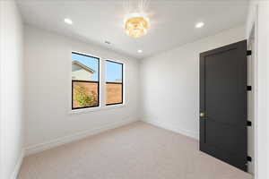Unfurnished room featuring light colored carpet and recessed lighting