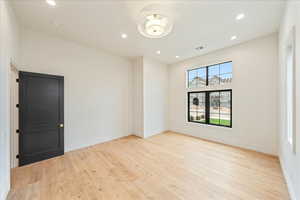Spare room featuring recessed lighting and light wood-style flooring