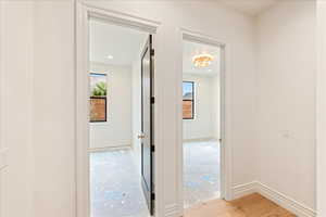 Hall featuring plenty of natural light and recessed lighting