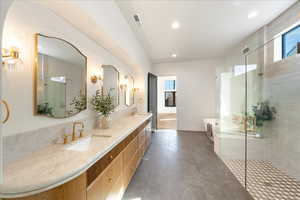 Full bath with a stall shower, double vanity, a garden tub, and recessed lighting