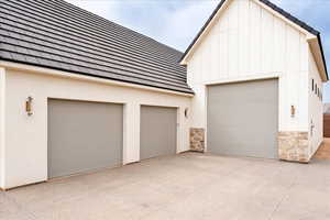 Garage with concrete driveway