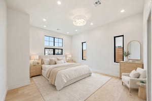 Bedroom with light wood-style flooring and recessed lighting