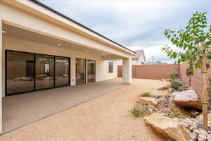 Fenced backyard featuring a patio area