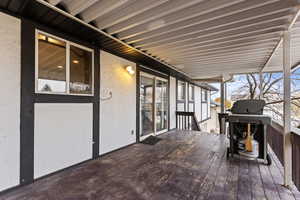 Wooden deck featuring grilling area