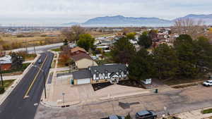 Aerial perspective of suburban area with a mountain backdrop