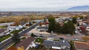 Aerial overview of property's location with nearby suburban area and a mountain backdrop