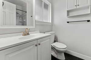 Full bath with vanity and a shower