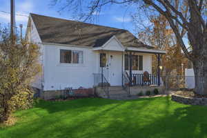 View of front of home featuring a porch and roof with shingles