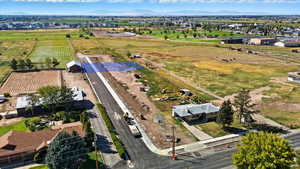 Aerial view of sparsely populated area featuring a mountain backdrop