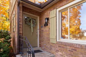 Entrance to property with brick siding