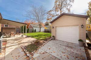 Detached garage featuring driveway