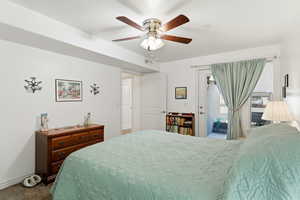 Bedroom featuring ceiling fan, access to outside, and carpet