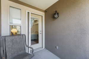Property entrance with stucco siding