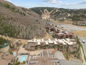 Aerial view of property and surrounding area featuring a pool area