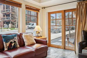 Sitting room featuring stone tile flooring