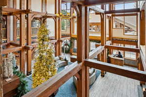 Misc room with light wood-style floors and a chandelier