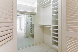 Spacious extra deep closet featuring adjustable shelves