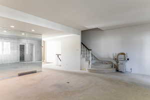 Carpeted spare room with recessed lighting