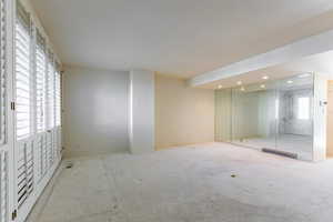 Unfurnished bedroom featuring carpet and recessed lighting