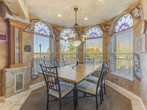 Dining room featuring tile patterned floors and recessed lighting