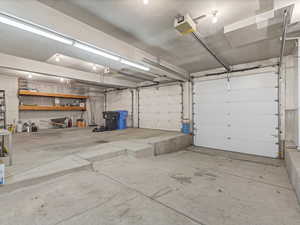 Garage featuring a garage door opener