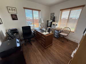 Office area with healthy amount of natural light and dark wood finished floors.  Third Bedroom
