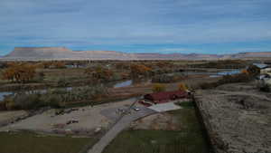 Aerial view of property's location featuring a water and mountain view and rural landscape
