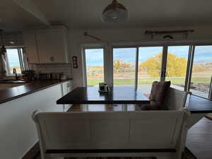 Dining area featuring dark wood finished floors
