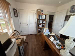 Office featuring dark wood finished floors