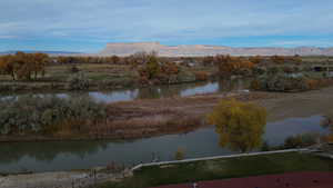 Water view featuring a mountainous background and rural landscape
