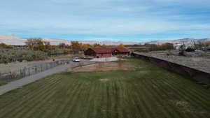 View of yard with a mountain view and a rural view