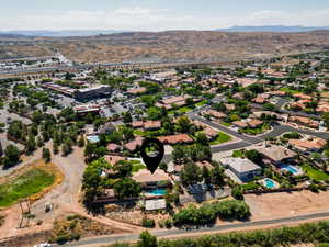 Aerial view of residential area featuring a mountainous background
