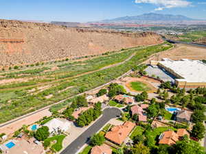 Aerial view of residential area featuring a mountainous background