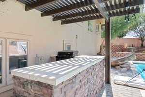 View of patio / terrace with a pergola and area for grilling
