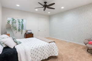 Bedroom with recessed lighting, carpet flooring, and ceiling fan