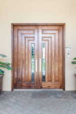 View of exterior entry featuring stucco siding