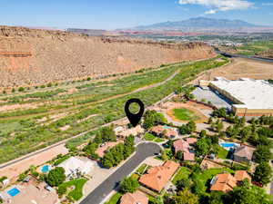 Aerial view of residential area featuring a mountainous background