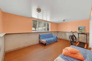 Sitting room featuring wood finished floors