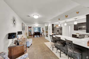 Living room featuring light colored carpet
