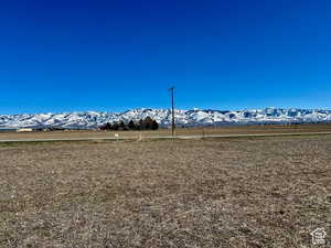 View of mountain backdrop with rural landscape