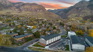 Aerial perspective of suburban area featuring a mountain backdrop