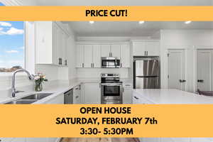 Kitchen featuring light stone countertops, stainless steel appliances, white cabinets, recessed lighting, and light wood finished floors