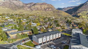 Aerial view of residential area featuring a mountain backdrop