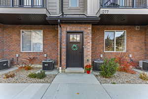 Front Doorway to property with brick siding