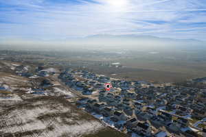 View of property location featuring nearby suburban area and a mountain backdrop