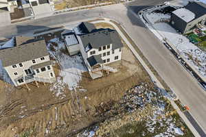 Snowy aerial view with a residential view