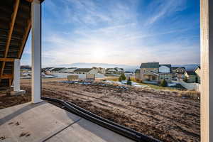 View of yard with a residential view, a mountain view, and a patio