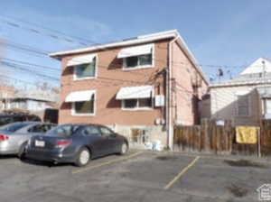 View of front facade featuring uncovered parking